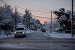 Drivers carefully drive through neighborhoods in Southeast Portland the morning after a snowstorm.