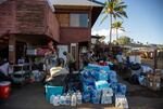 Donated items for those affected by the wildfires are sorted at Buzz's Wharf in Maalaea Harbor.