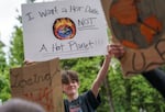 In this 2022 file photo, Ida B. Wells High School student Mac McCarter chants with other youth climate activists in a push for meaningful climate response. Portland Public Schools, where Ida B. Wells is based, is one of seven districts that will receive funds to support climate action under a plan approved Wednesday.