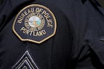 A photo of a Portland police patch on an officer's uniform.