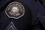 A photo of a Portland police patch on an officer's uniform.