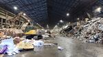 Oregon Metro workers clear through garbage buildup at a transfer station in January 2022.