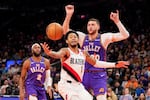 Portland Trail Blazers guard Anfernee Simons (1) loses control of the ball during the first half of an NBA basketball game against the Phoenix Suns, Sunday, Dec. 15, 2024, in Phoenix.