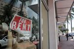 In this July 13, 2020 file photo, a For Rent sign hangs on a closed shop during the coronavirus pandemic in Miami Beach, Fla.  Having endured what was surely a record-shattering slump last quarter, the U.S. economy faces a dim outlook as a resurgent coronavirus intensifies doubts about the likelihood of any sustained recovery the rest of the year.