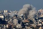 A picture taken from southern Israel on the border with the Gaza Strip shows smoke billowing over the Palestinian territory during Israeli bombardment on Jan. 19.