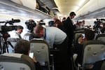 Journalists attend into the papal flight after takeoff was delayed at Los Rodeos International Airport, at the Canary Islands, Spain, Friday, June 12, 2026.