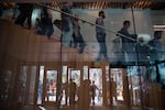 FILE — Employees walking in Amazon's Seattle headquarters.