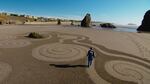 Denny Dyke creates labyrinths in the sand in Bandon, Oregon.