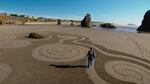 Denny Dyke creates labyrinths in the sand in Bandon, Oregon.