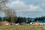 In this provided by Sgt. Jeremy Landers of the Marion County Sheriff's office, the wreckage of a Barn near St. Paul, Ore., smolders on Thursday, Feb. 3, 2022, after a fire and explosion destroyed it. A firefighter was critically injured in the explosion and has been airlifted to a hospital. Investigators were at the scene to determine the cause of the fire and explosion.