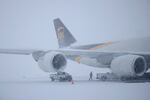 A United Parcel Service, Inc. (UPS) Boeing 747 cargo jet sits parked in the snow at Louisville Muhammad Ali International Airport on January 5, 2025 in Louisville, Kentucky. Local forecasts called for heavy snowfall followed by significant accumulation of freezing rain and ice. 