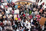 Trans-rights activists holding signs protest outside the House chamber at the Oklahoma Capitol in Oklahoma City in 2023.