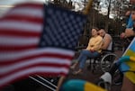 Sgt. Misha Varvarych, a Ukrainian war amputee, and his fiancé Ira Botvynska take a stroll at Lake Eola Park 