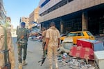 Army soldiers patrol a market area in Khartoum on March 24, 2025. For nearly two years, Sudan has been ravaged by a war between the regular army and the RSF, a conflict that has killed tens of thousands of people, uprooted over 12 million more and created the world's largest hunger and displacement crises.