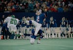 Seth Joyner (not shown) of the Philadelphia Eagles blocks a field goal attempt by kicker Raul Allegre (2) of the New York Giants, as Andre Waters (20) also makes a diving effort at Giants Stadium in East Rutherford, N.J., Dec. 6, 1987. Allegre later kicked a 28-yard field goal to give the Giants a 23-20 win over the Eagles.