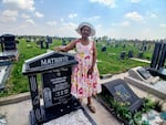 Paulina Mathinye stands at her father's graveside at a cemetery in Sharpeville, South Africa, on 23 September, 2026.