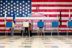 Voters cast their ballots at Robious Elementary School in Chesterfield County, Va.