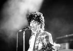 Prince performs at the Orange Bowl during his Purple Rain tour in Miami, Fla., April 7, 1985. 