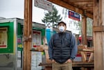 Aldo Medina Martinez, programs director for the Portland Mercado in SE Portland, Ore., poses for a portrait in front of the market's food cart pod on Wednesday, May 20, 2020. Medina Martinez oversees the Mercado's various business programs.