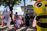 Rob Gelancey, dressed in an inflatable bumblebee suit, dances and protests with other demonstrators outside of the U.S. Immigration and Customs Enforcement facility in Portland, Ore., on Monday, Oct. 20, 2025, shortly after the U.S. Court of Appeals for the 9th Circuit ruled that the National Guard can deploy to the city.