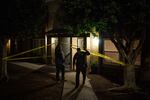 Ed Byrne, Homeland Security investigations agent, left, and Lt. Ken Impellizeri of the San Diego Police leave the scene of a fatal fentanyl overdose by a 39-year-old woman in San Diego, Calif., on Nov. 10.