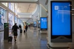 Screens show a blue error message at a departure floor of LaGuardia Airport in New York on Friday, July 19, 2024, after a faulty CrowdStrike update caused a major internet outage worldwide for computers running Microsoft Windows.