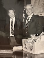 Percy Loy and Oregon Gov. Victor Atiyeh, right, at a government meeting with the food industry, at an unspecified location in the 1970s.