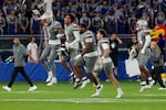 Members of UNLV run onto the field after a 23-20 win over Kansas during an NCAA college football game, Friday, Sept. 13, 2024, at Children's Mercy Park in Kansas City, Kan. (AP Photo/Ed Zurga)