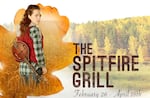 Illustration of a young woman with a stringed musical instrument carried over her shoulder standing in tall grass with trees off in the distance, and the text The Spitfire Grill, February 26-April 18th
