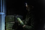 Callsign "Babai", drone pilot and explosives technician of Dovbush's hornets unit of 68th Separate Jäger Brigade holds in hands mortar munition. The unit uses it for dropping from drones.