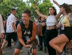 Cassie Bone, left, joins others in dancing to T-Pain at the Project Pabst festival in Portland in July.