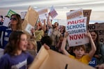 The crowd chants as they line up to attend a Portland Public School Board meeting about closing up to 14 schools, outside the Dr. Matthew Prophet Education Center in Portland, Ore., on Oct. 6, 2026.