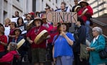 Rachel Kidd, 57, in blue, gathers with other members of the Chinook Indian Nation and allies on the steps of the Henry M. Jackson Federal Building on Monday, August 29, 2022, to rally for the restoration of federal recognition for the Chinook Indian Nation, in Seattle.
