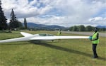 Teens of the Hood River Soaring club roll a glider to the runway. By working as ground crew, they learn the procedures and safety protocols before taking to the sky.