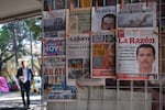 Newspapers hang on display for sale in Mexico City, Monday, Feb. 23, 2026, a day after the Mexican army killed Jalisco New Generation Cartel leader Nemesio Oseguera Cervantes, known as "El Mencho."