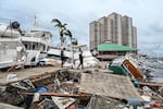 Boats are left stranded on the shore in the aftermath of Hurricane Ian in Fort Myers, Fla., on Sept. 29, 2022.