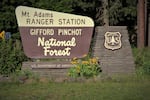 The iconic brown and yellow signs used by the U.S. Forest Service are the enduring design of a northwest ranger, Virgil "Bus" Carrell.