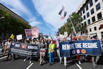 Protesters march down Pennsylvania Avenue for Saturday's "No Kings" protest  in Washington, D.C.