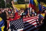 Venezuelans celebrate after U.S. President Donald Trump announced that Venezuelan President Nicolas Maduro had been captured and flown out of the country in Santiago, Chile, Sat, Jan. 3, 2026.