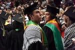 Students of Portland State University wave Palestinian flags during the university's 2024 commencement ceremony at the Moda Center on June 16, 2024.