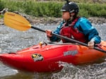 Tasia Linwood, who has Karuk ancestry, kayaks the Klamath River on June 22 where the Iron Gate Dam once stood.
