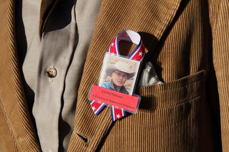 Mourners wore ribbons, and some pinned squares cut from a blue tarp to their coats, a reference to a nickname some gave Finicum during the occupation of the Malheur National Wildlife Refuge.