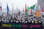 Protesters stage a rally demanding the arrest of impeached South Korean President Yoon Suk Yeol near the presidential residence in Seoul, South Korea, on Sunday. The letters read "Arrest Yoon Suk Yeol."