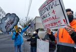 (Left to right) Douglas Yarrow, Jae Kauffman, (CQ), Ted Rabern, Jr., and Ollin T. (no last name given) attend a rally in this Jan. 18, 2022 file photo at the Bureau of Transportation’s Stanton Yard in North Portland in support of city workers. District Council of Trade Unions’ negotiations with the city have reached an impasse and DCTU announced Thursday it plans to strike. DCTU represents approximately 1,100 city employees.