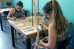 Karina Goicochea (left) and Jacquelyn Rostel (right) at DIY Bar n Portland, where cocktails and craft beer are served side by side with macrame projects and metalwork.