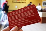 One of the few red cards that remained at a recent visit to the St. John’s health clinic. The card provides sample statements for people interacting with federal immigration agents.