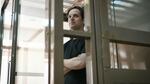 Evan Gershkovich, the U.S. reporter detained on espionage charges in Russia, stands inside a defendants' cage before a hearing to consider an appeal of his extended detention at the Moscow City Court. His appeal was rejected.