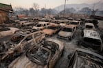 Cars are left charred inside a dealership in the aftermath of the Eaton Fire Friday, Jan. 10, 2025 in Altadena, Calif.