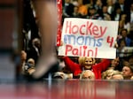 A delegate holds up a sign reading "Hockey Moms for Palin!" as then-Republican U.S vice-presidential nominee Alaska Gov. Sarah Palin speaks in 2008.