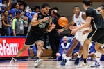 FILE - Dartmouth's Robert McRae III (23) takes a pass from Jackson Munro (33) as Duke's Jaylen Blakes (2) defends during the second half of an NCAA college basketball game in Durham, N.C., Monday, Nov. 6, 2023.